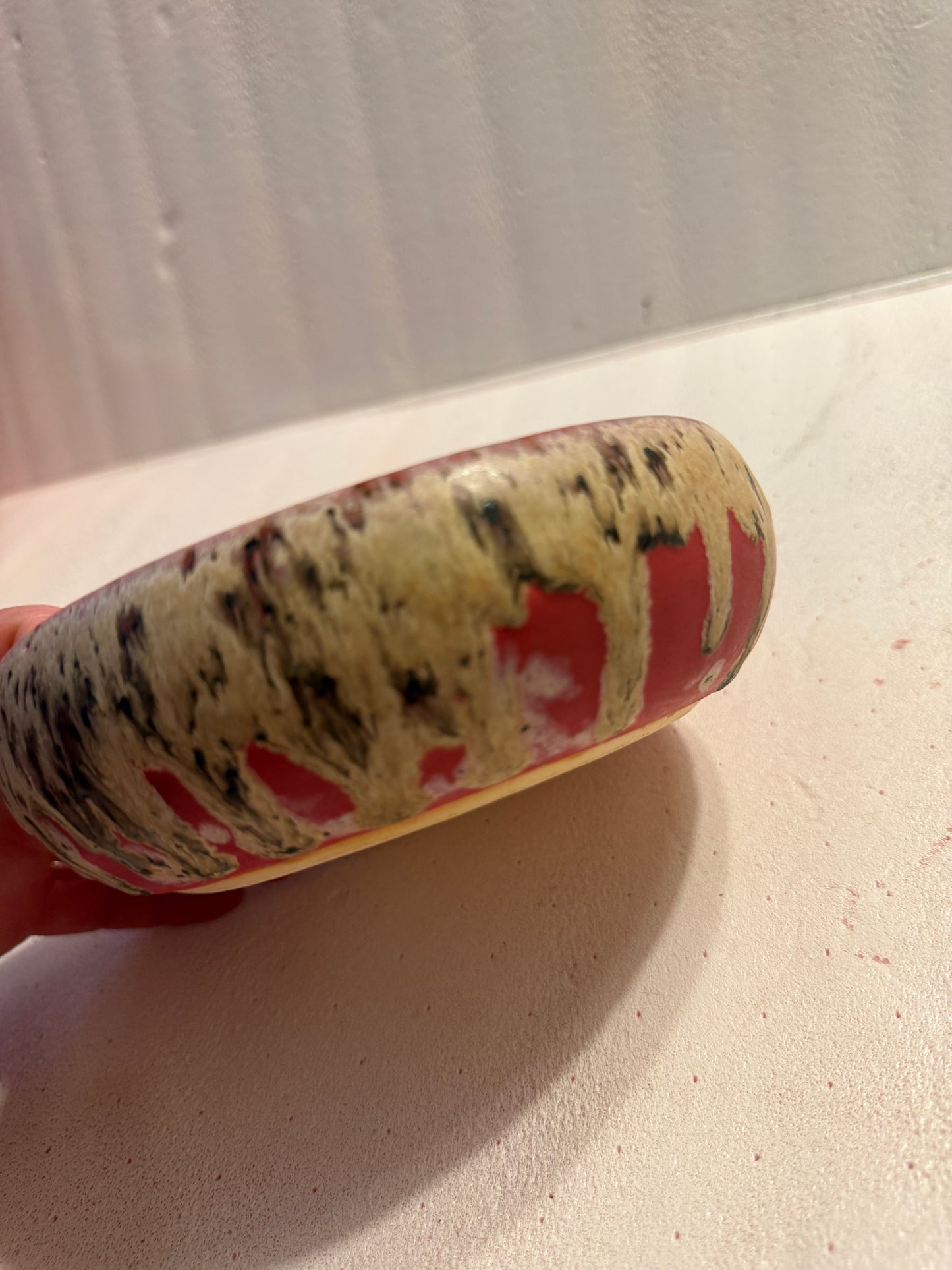 Wide, low bowl- red w/drippy glaze