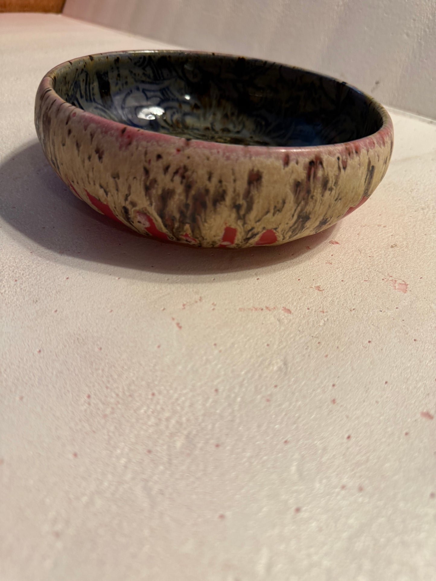 Wide, low bowl- red w/drippy glaze