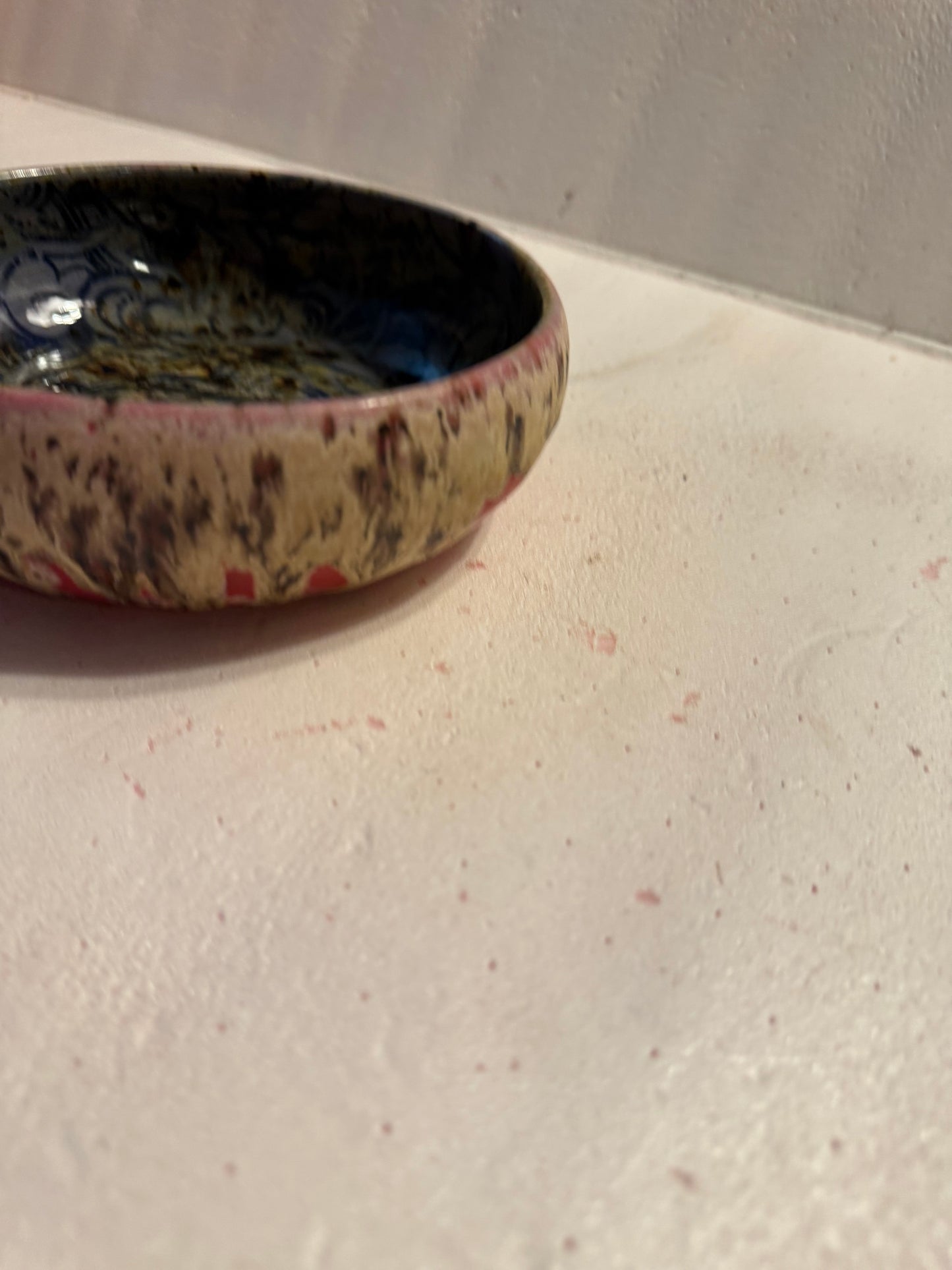 Wide, low bowl- red w/drippy glaze